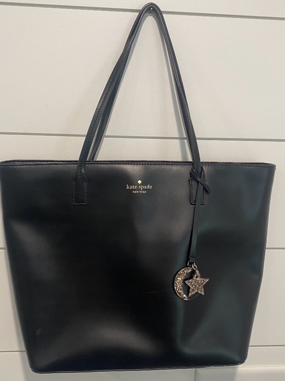 kate spade black leather tote with moon and star charm